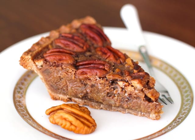 maple pecan pie slice served on a china plate